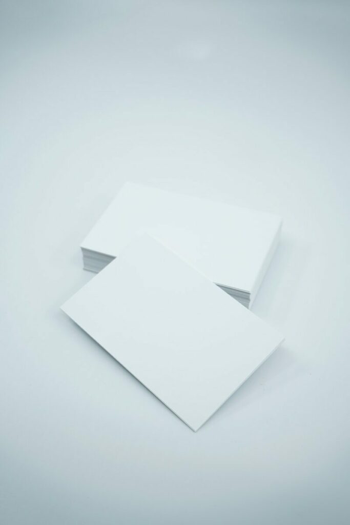 two blank paper sheets on a white background