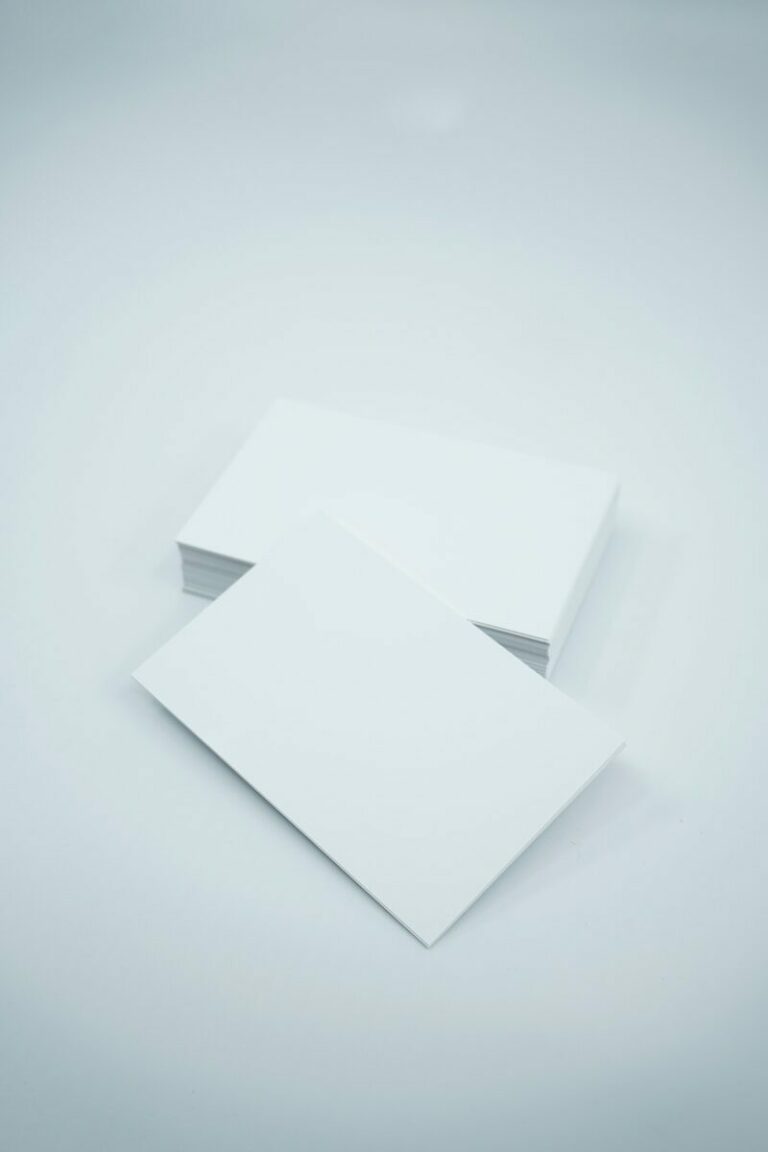 two blank paper sheets on a white background